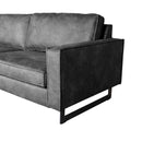 Sofa 3 places en cuir anthracite avec piètement métallique noir.