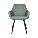 Chaise en simili-cuir vert avec une structure métallique noire robuste. 
