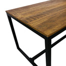 Table en bois massif avec un piètement en métal noir.