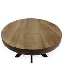 Table ovale 180 cm avec piètement en métal noir et plateau en manguier.